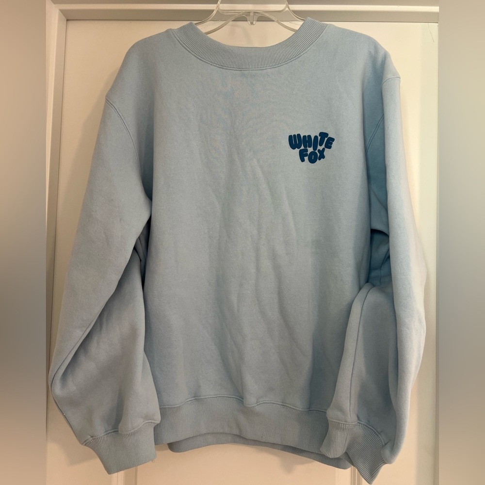 Women’s White Fox Boutique Light Blue Pullover Fleece Sweatshirt. Size M/L.